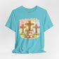 BELLA  CANVAS - Easter Bunny Kneeling at Crosses T‑Shirt — Christian Easter Faith Tee