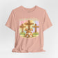 BELLA  CANVAS - Easter Bunny Kneeling at Crosses T‑Shirt — Christian Easter Faith Tee